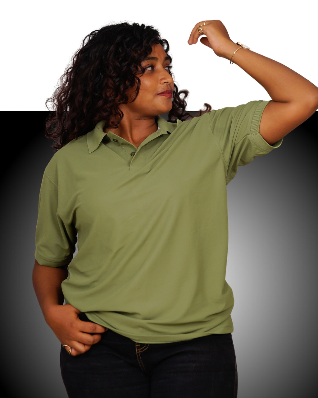 Woman wearing a green polo shirt against a gradient background