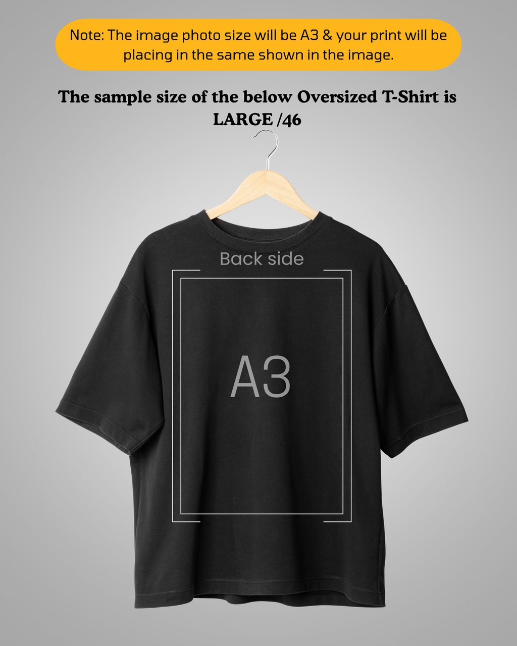 Black t-shirt on a hanger with 'A3' text on the back, against a gray background.