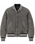 Gray denim jacket with black and white striped accents on a white background