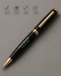 Black pen with gold accents on a gray background, featuring brand customization options.