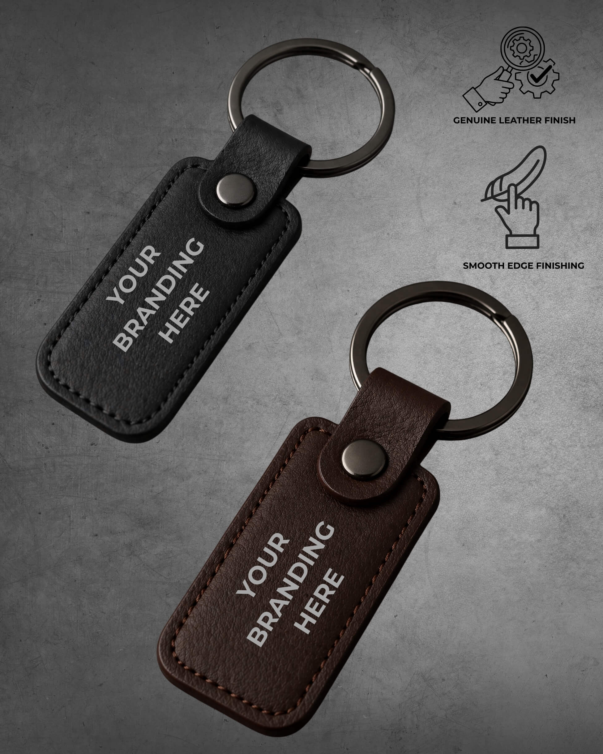 Two leather keychains with customizable text on a gray background