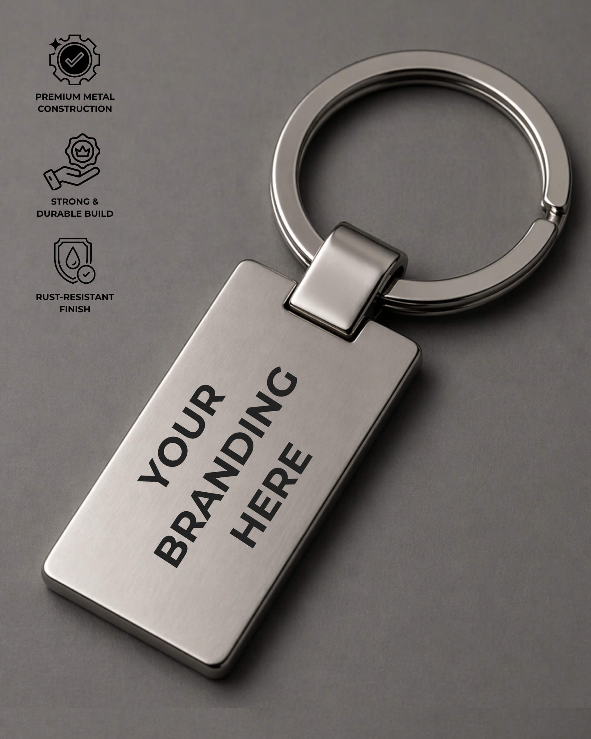 Metal keychain with 'Your Branding Here' text on a gray background