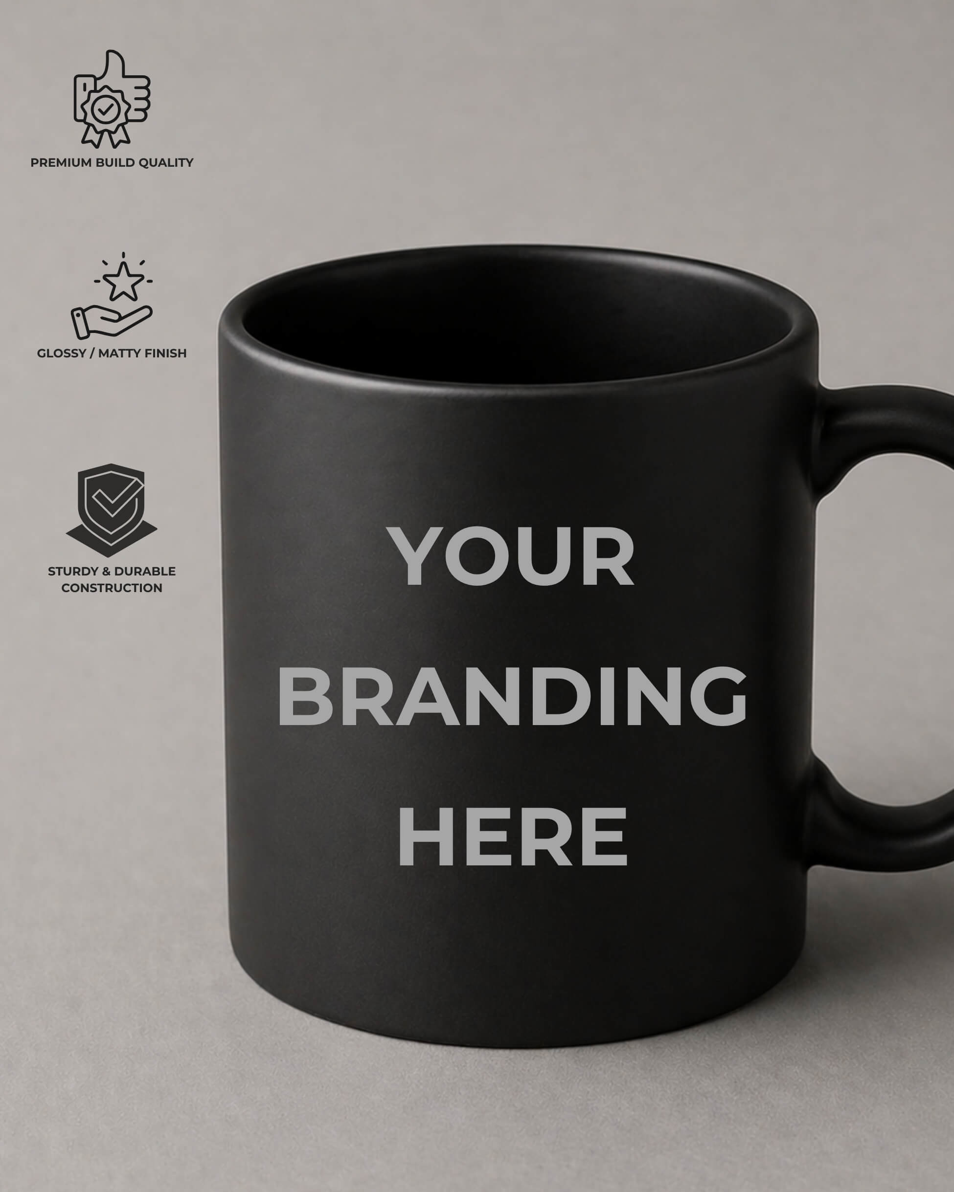 Black mug with 'Your Branding Here' text on a gray background