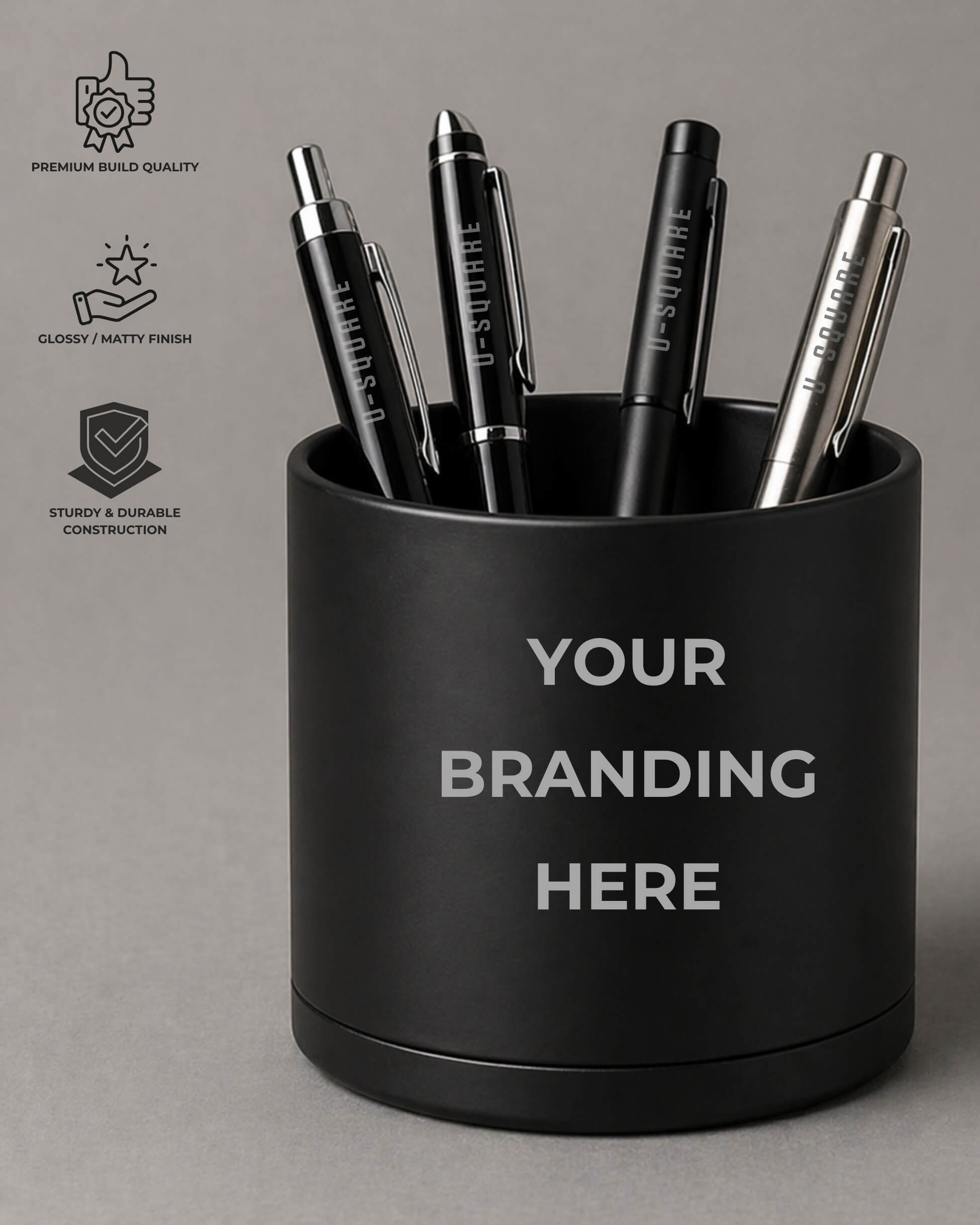 Black pen holder with pens and 'Your Branding Here' text on a gray background