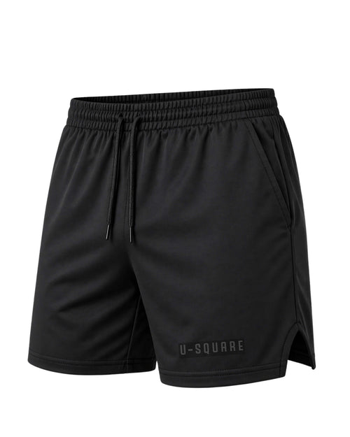 Black athletic shorts with a brand logo on a white background