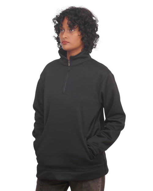 Person wearing a black pullover with a zipper on a white background