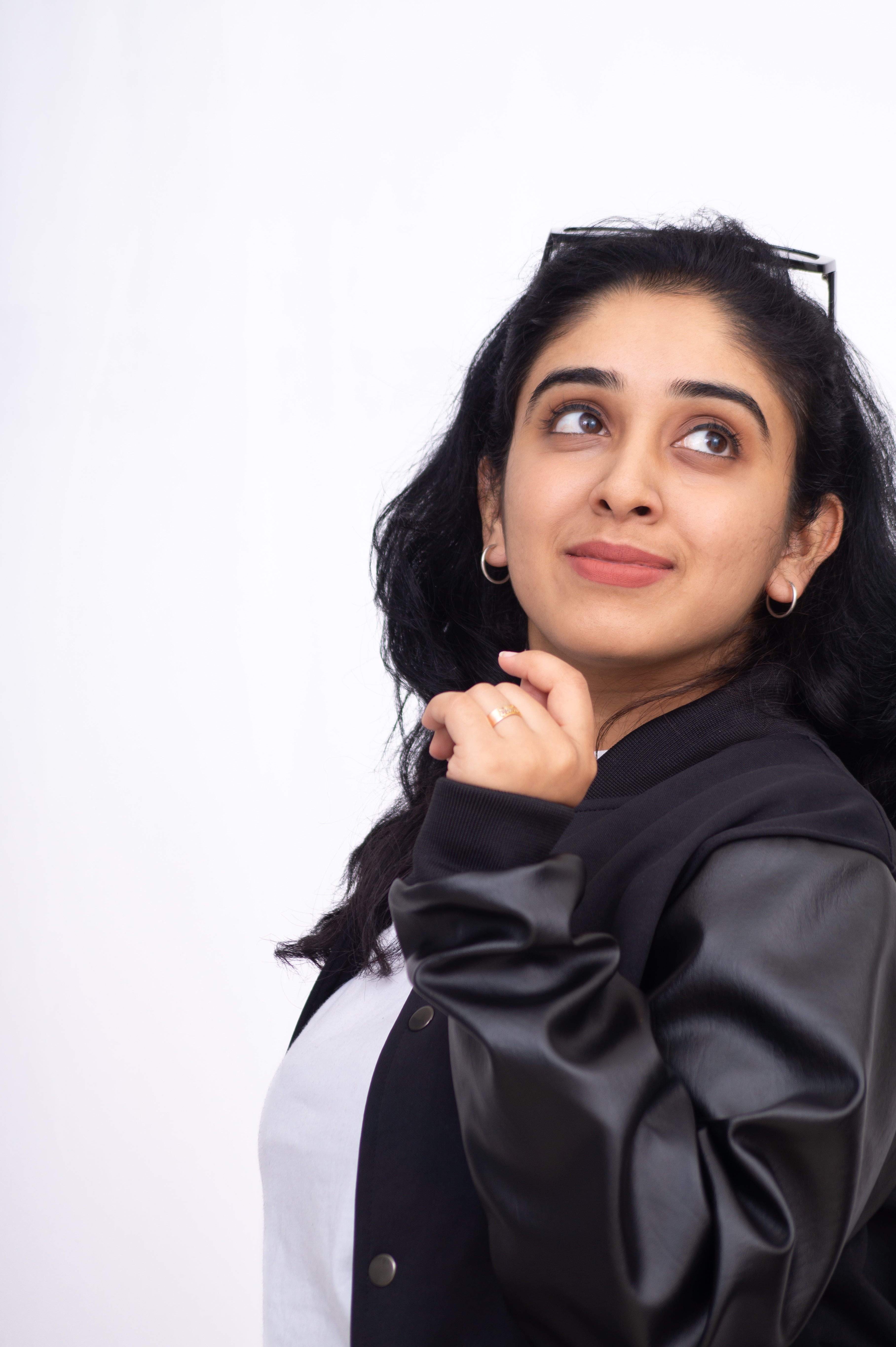 Woman wearing a black jacket on a white background